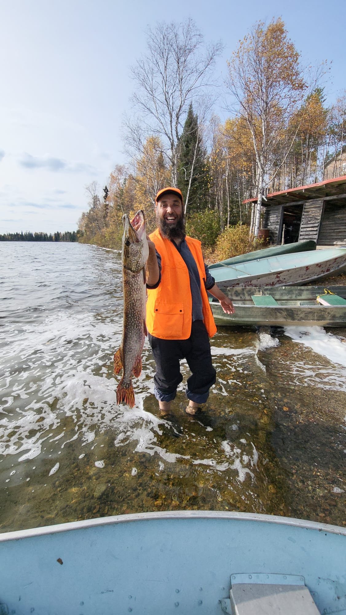 Guest holding a fish caught near Pickle Lake
